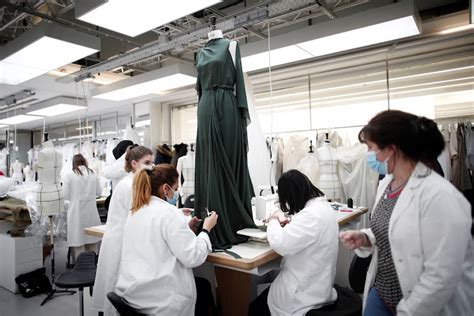 dior employee uniform 2021|Employees, wearing protective masks, prepare a dress for the .